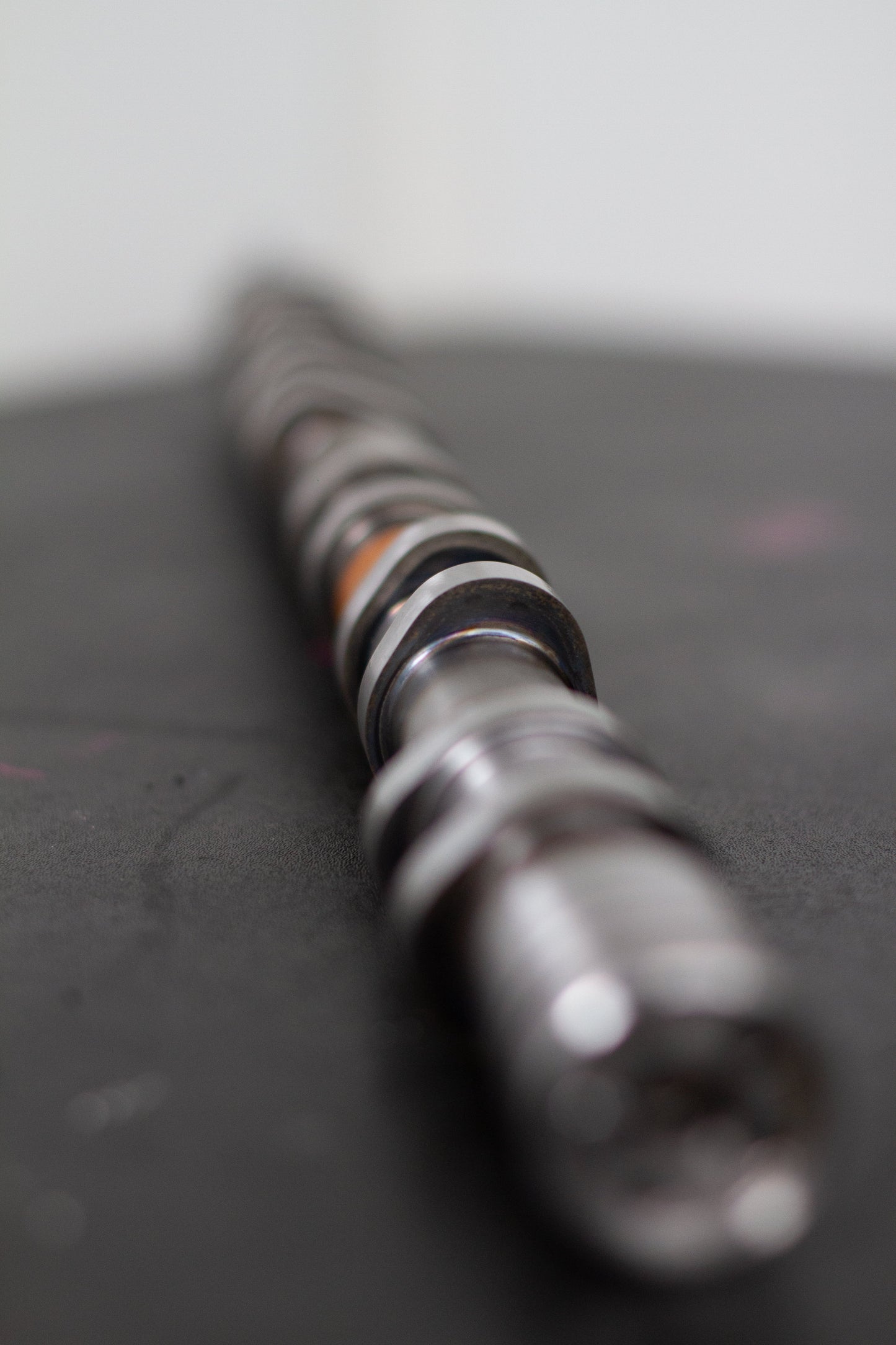 Close-up of a camshaft on a dark background