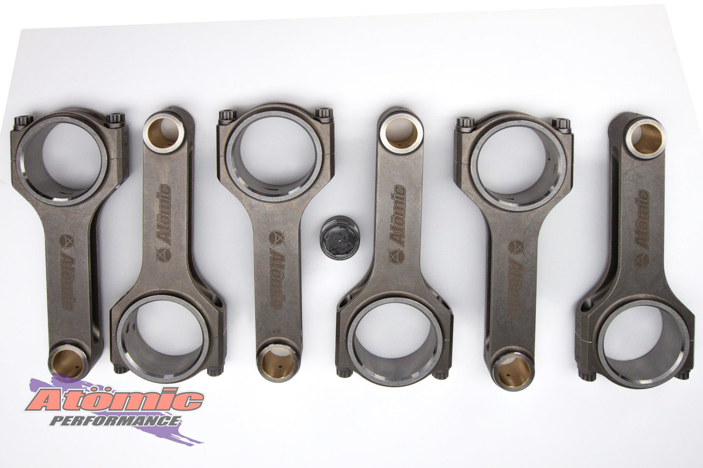 Set of connecting rods with Atomic Performance logo on a white background