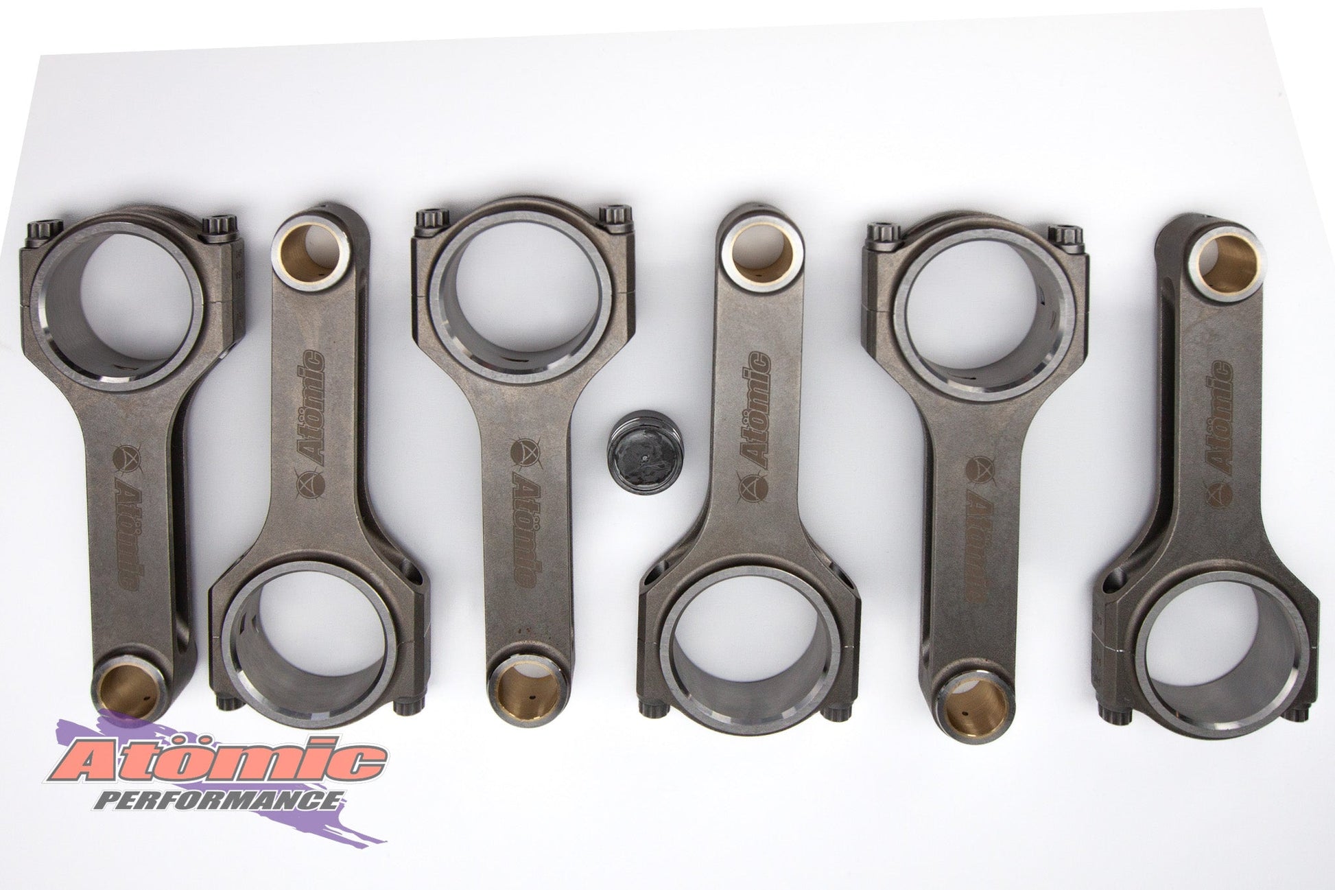 Set of connecting rods with Atomic Performance logo on a white background