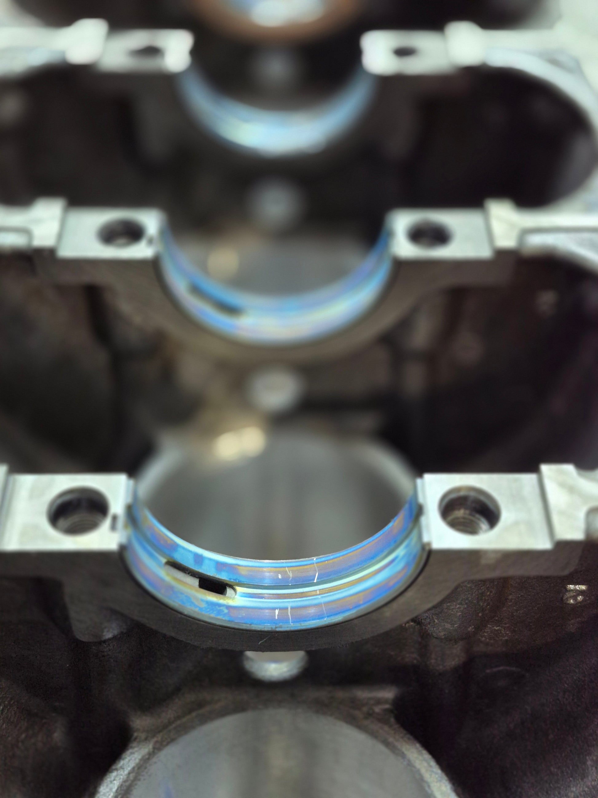 close-up of main bearing installation inside engine block