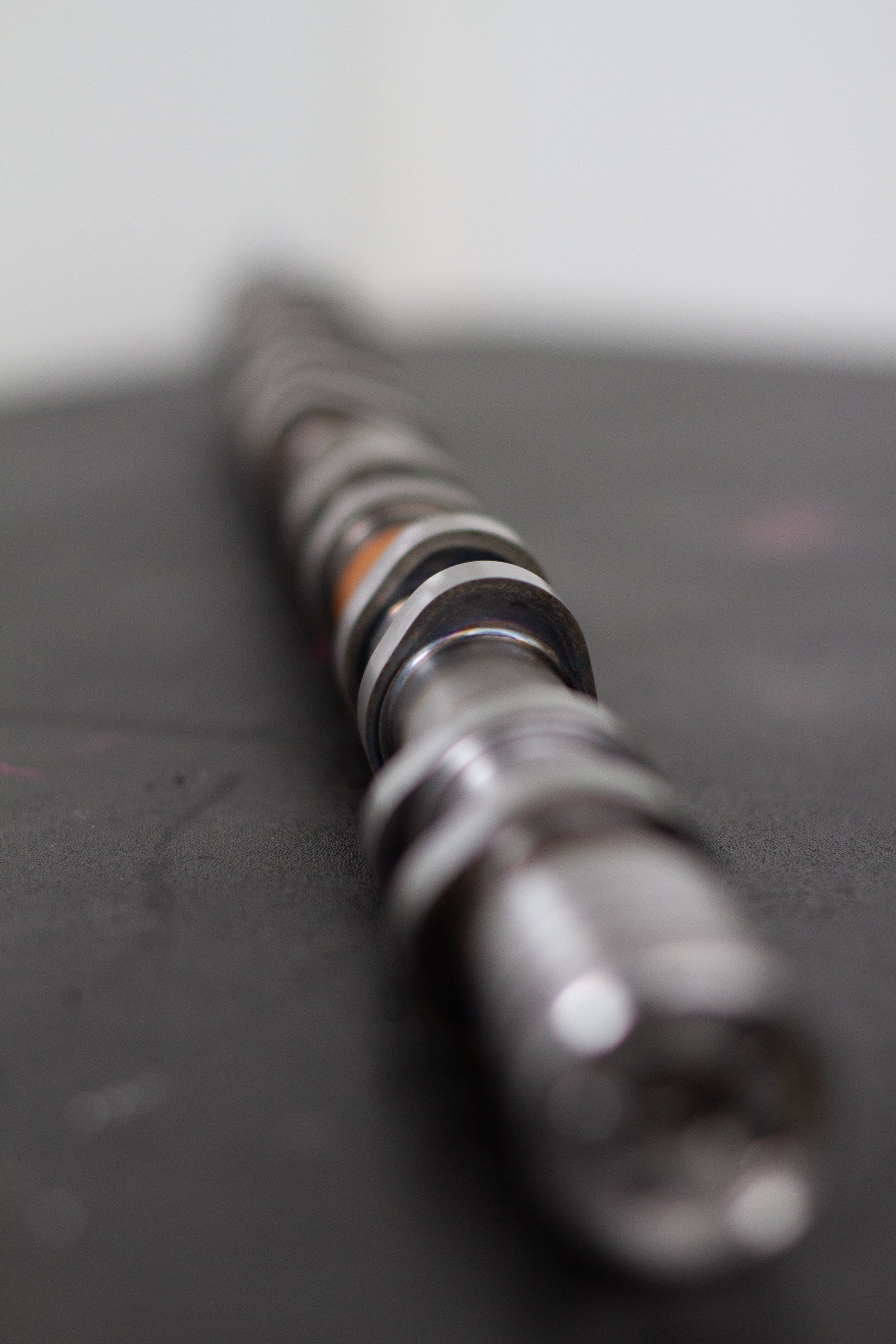 Close-up of a camshaft on a dark background