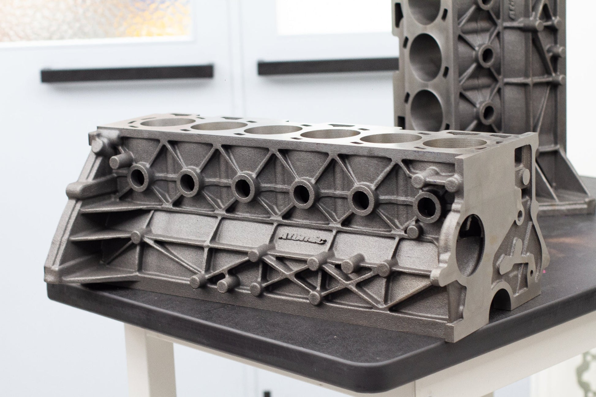 engine cast block on a black bench 