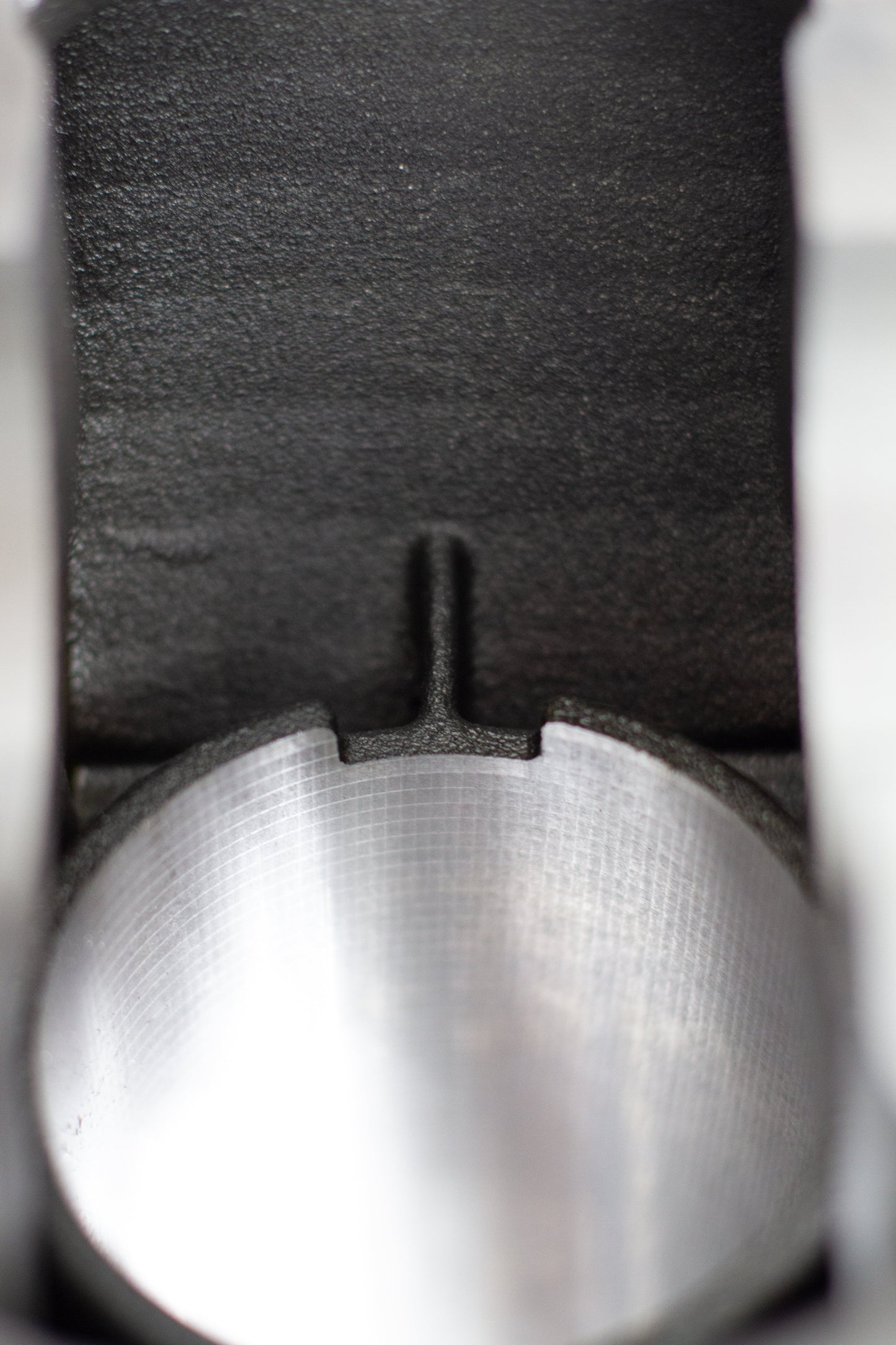 close up of cast engine block relief rod cut out