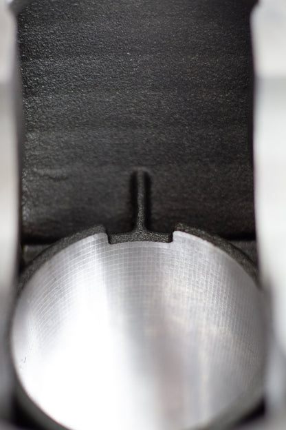 close up of cast engine block relief rod cut out