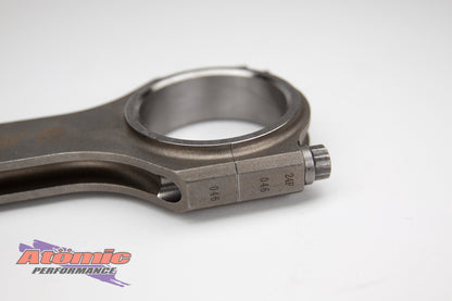 Metal connecting rod with atomic performance products branding on a white background