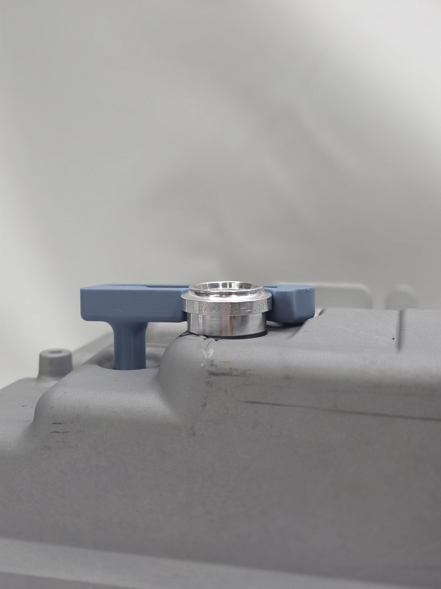 close up of weld on and fitting jig with white background