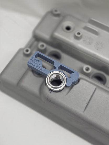 close up of weld on orb with 3d printed fitting jig on engine rocker cover with white background