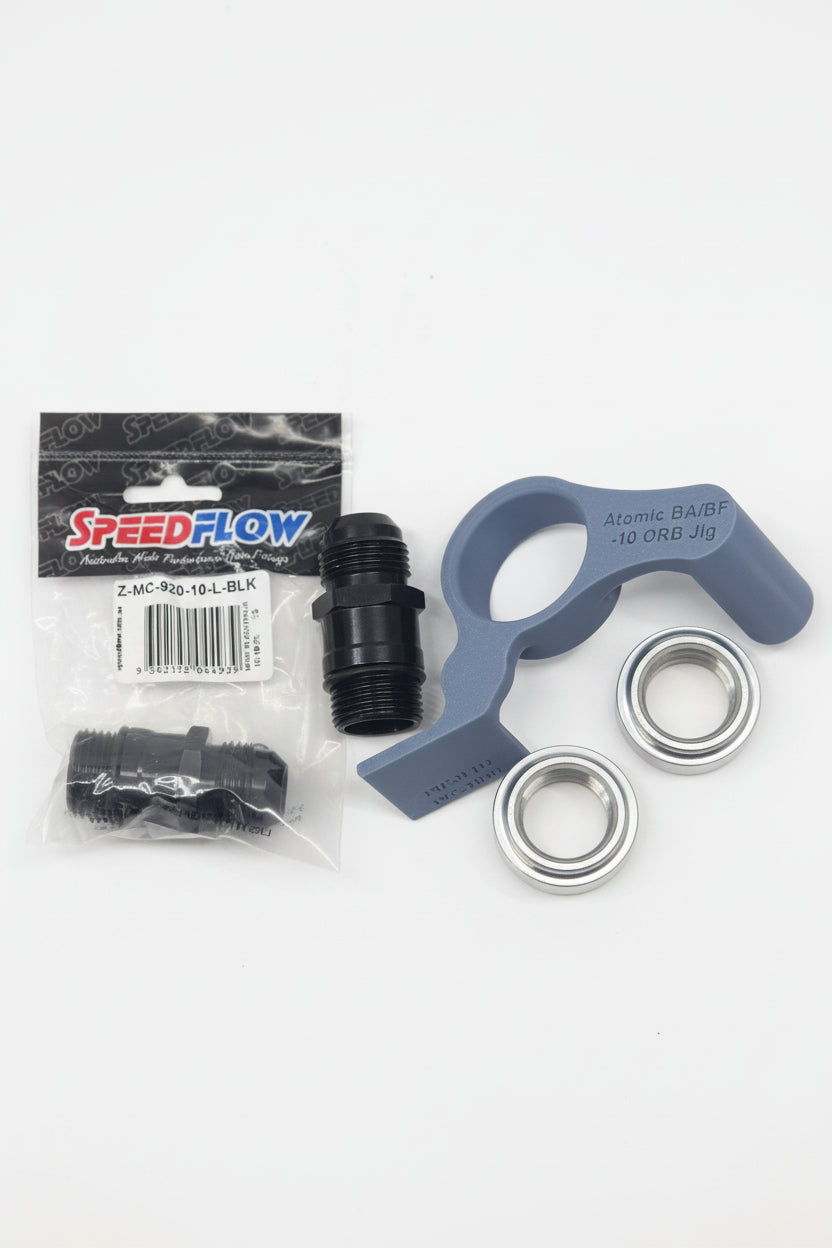 speedflow packaging of black weld on bungs with aluminium extension fittings and 3d printed fitting jigs with white background