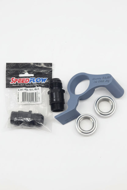 speedflow packaging of black weld on bungs with aluminium extension fittings and 3d printed fitting jigs with white background