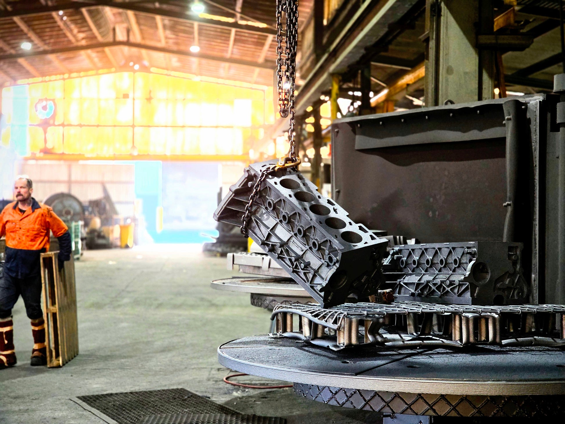 engine cast block in factory attached to chain 