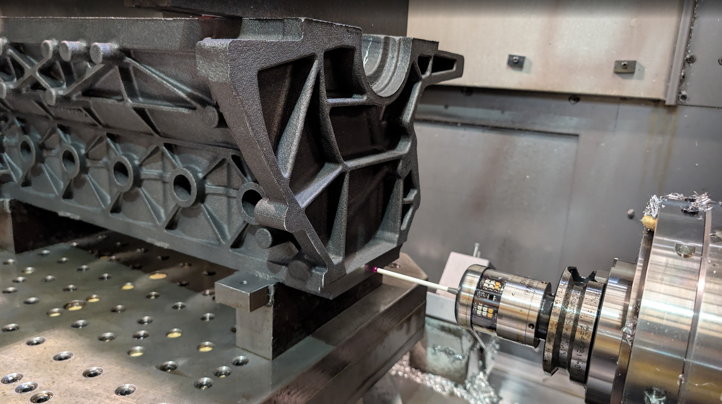 machining of cast engine block with steel background