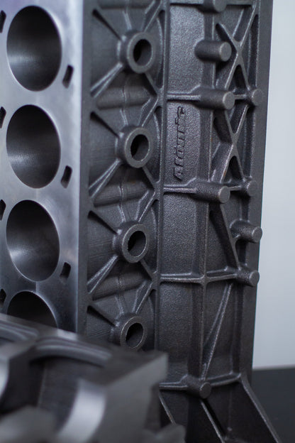 gray upright cast engine block with white background