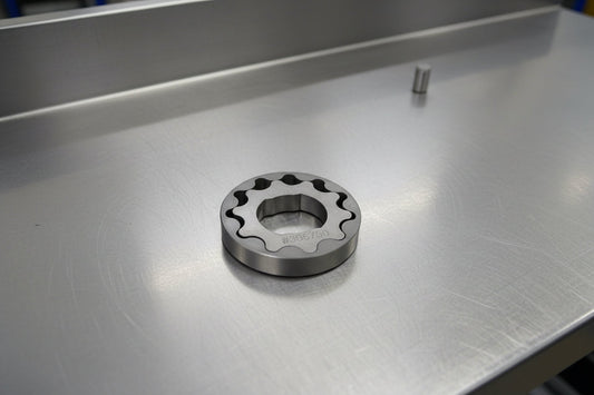 steel oil pump gears on a steel background
