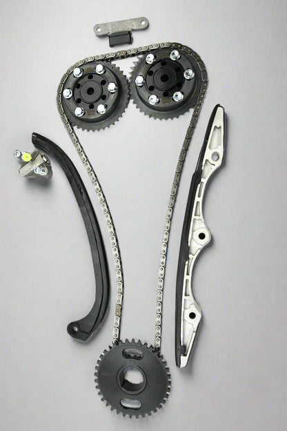 Automotive timing chain set with gears and sprockets on a white background