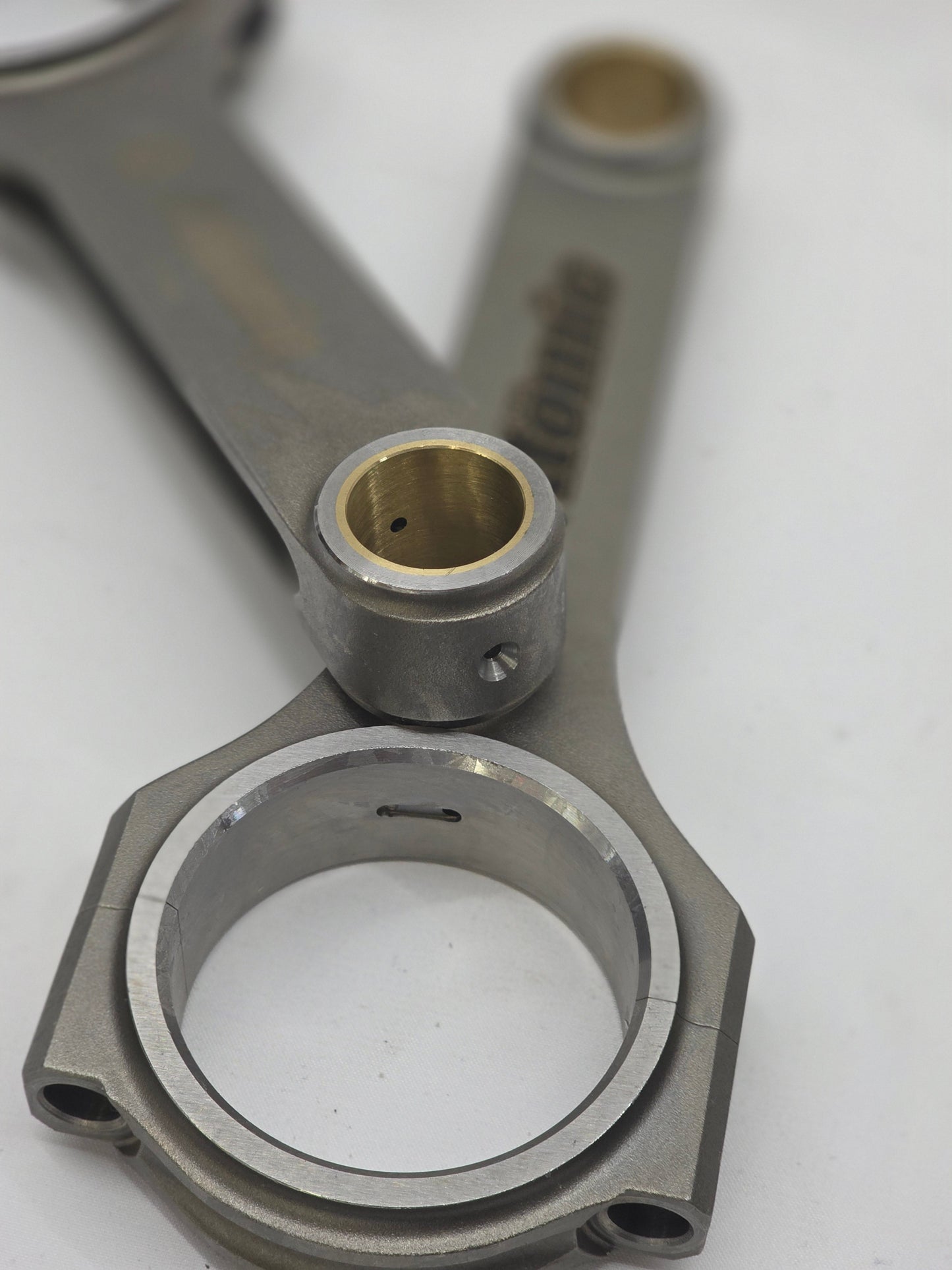 Metal connecting rod on a white background
