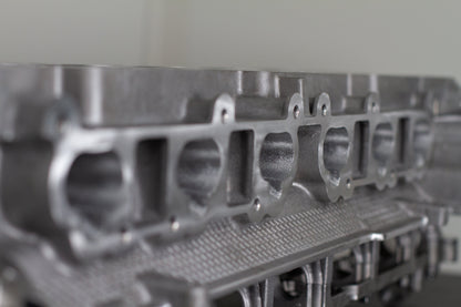 metal engine cylinder head with white background