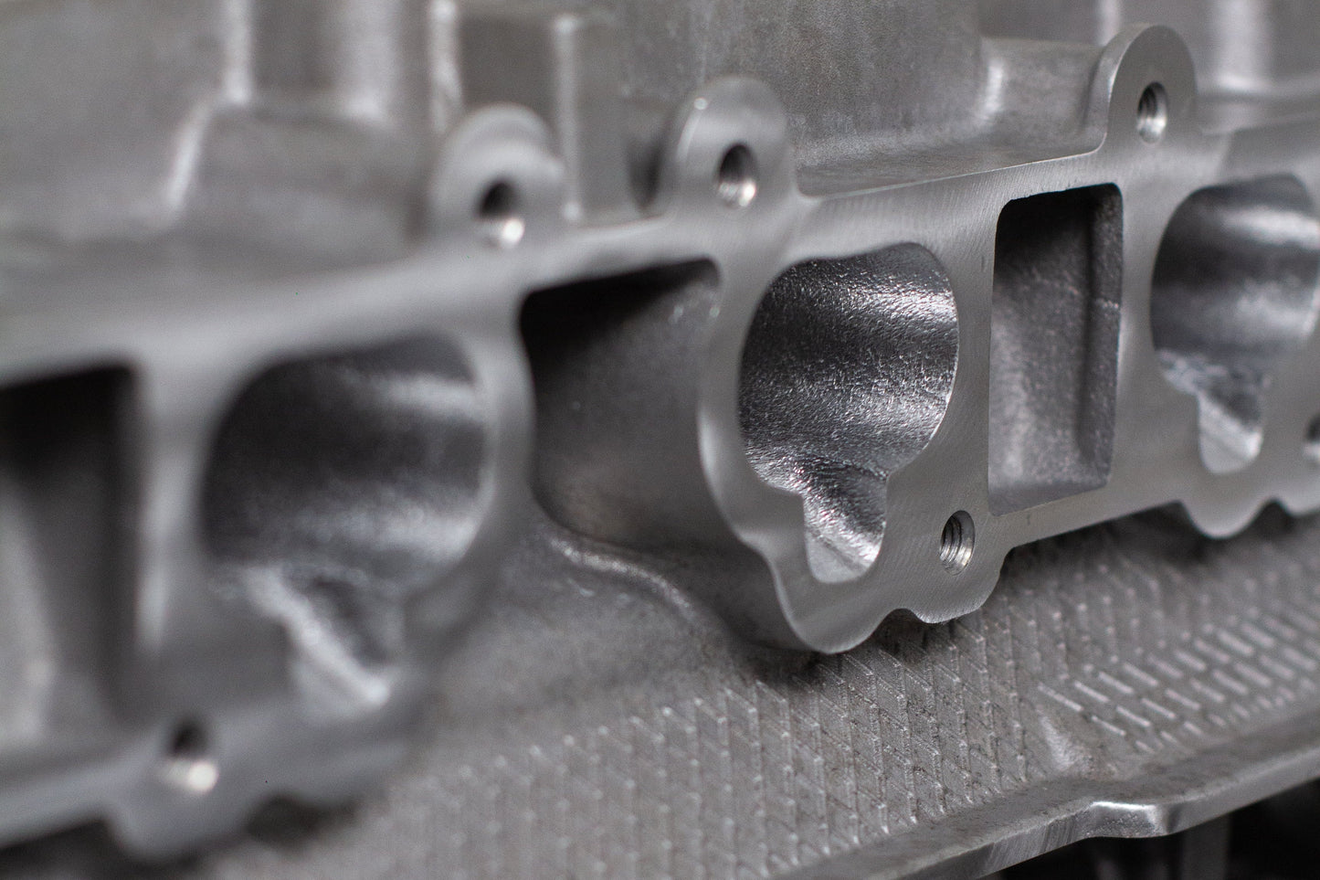 close up of a engine cylinder head intake ports