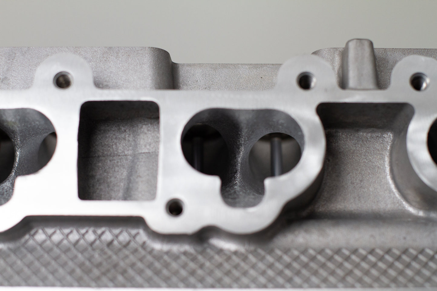 close up of engine cylinder head intake ports
