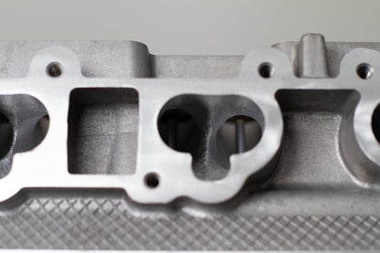 close up of engine cylinder head intake ports